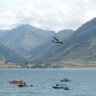 Planes, boats and jet skis search for a missing skydive passenger in Lake Wakatipu yesterday....