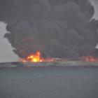 Smoke and fire is seen from Panama-registered tanker Sanchi carrying Iranian oil after it...