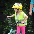 Carisbrook School pupil Chloe Farrar (6) gets a road safety refresher from her mother, Katrina,...