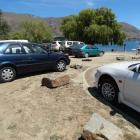 Cars park on grassy areas along Wanaka’s lakefront over the New Year period. Photo: Kerrie...