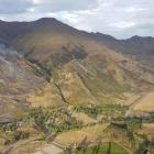 An aerial photo of the smoke rising from the Mt Roy fire in Wanaka this morning. Photo: Fire and Emergency New Zealand