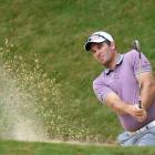 New Zealand No1 Ryan Fox hits out of a bunker during practice at The Hills yesterday. Photo:...
