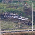 The remains of an F-16 Israeli war plane can be seen near the Israeli village of Harduf. Photo:...
