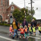 teachers (from left) Kim Ruthven and Roberta Carvalho, and head teacher Lyn Morton,  cross the...