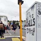 A Chorus telecommunications box in North Dunedin in the process of having graffiti removed. Photo...