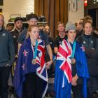 Zoi Sadowski-Synnott (L) and Nico Porteous are welcomed home at Auckland International Airport...