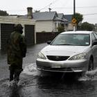 A  driver revs the engine of his car shortly before surging  past Mr McFarlane. Photos: Gregor...