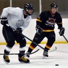 Whitehorse Goldpuckers player Greg Lane controls the puck in a match against Jurassics during a...