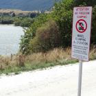New signs at the entrance to the northern end of Lake Hayes advise  freedom campers they are no...
