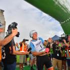 Sam Clarke  cracks open the bubbly at the finish line after winning the Longest Day race of the...