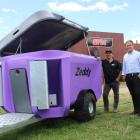 Zeddy team members Shane Parlato and Pearse McGoughan show off the Zeddy 1250 Dry Feeder, which...
