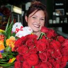 Dunedin florist Donna Hewer with red roses and a colourful bouquet for Valentine’s Day. Photo:...