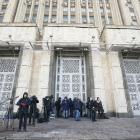 Journalists wait for the British Ambassador to Russia Laurie Bristow at the Russian Foreign...