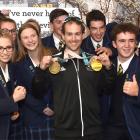Paralympic skier Adam Hall shows his bling to Taieri College pupils. Photo: Peter McIntosh
