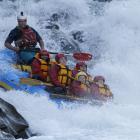 Keith 'Chief' Haare, pictured at the back of the raft, on the rapids. Photo: supplied