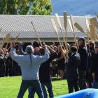 A haka is performed while paddles are raised to form a guard at the funeral of Moana-Roa 'Chief'...