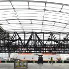 Workers assemble lighting racks at Forsyth Barr Stadium yesterday, before Ed Sheeran's three...