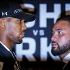 Anthony Joshua (left) and Joseph Parker square off during a press conference at the Dorchester...