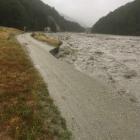 The Rees River encroaches on to Rees Valley Rd earlier this year. Photo: QLDC