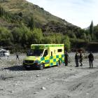 A Lakes District Air Rescue Trust helicopter prepares to take off from a beach at Arthurs Point,...