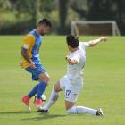 Southern United midfielder Alex Risdale (left) and Waikato's Xavier Pratt clash in the mach at...