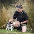 Dog handler Angela Newport and dog Macca finish their search for predators at Orokonui...