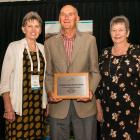 Alexandra man Gavin Dann celebrates his Irrigation New Zealand 2018 Ron Cocks Award with his wife...
