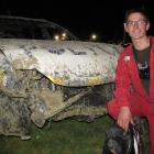 Wanaka racegoer Patrick Rietveld inspects his worse-for-wear car after winning the demolition...