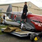 The heavily damaged Yak 3 is moved to a hanger at Wanaka Airport. Photo: Stephen Jaquiery