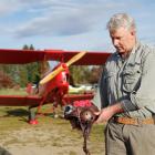 Before taking off in a Tiger Moth for a flyover of an Anzac Day service in Lowburn, Daniel...