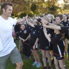 Fairfield School pupils greet Richie McCaw at their school today.. Photo: Gerard O'Brien