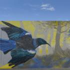 Artist Deow Owen works on a mural in Orari St, South Dunedin. Photo: Gerard O'Brien