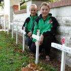 Maheno School pupils Lillie Silcock (11) and Brooke Purvis (11) at the Maheno War Memorial with...