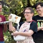 Otago University Students’ Association queer support co-ordinator Hahna Briggs (centre) gets...