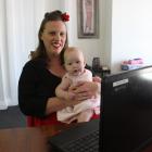 Share Your Space founder Bronwyn Bay works at home with her daughter Maggie (5 months). PHOTO:...