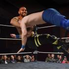 Invercargill wrestler Kane Khan (real name Kane Bates) lifts ‘‘Hooligan’’ Marcus Kool (Marc Perry...