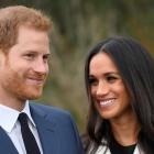 Prince Harry poses with Meghan Markle in the Sunken Garden at Kensington Palace in London. Photo...