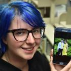 Amy McCarthy, with a picture of her boyfriend who was killed in an accident near Shag point two...