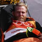 Byron Wells is stretchered off by medical staff after his crash at the Olympics. Photo: Getty Images
