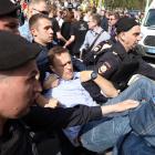 Russian opposition leader Alexei Navalny is carried away by police during protests against the...