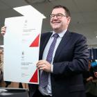 Finance Minister Grant Robertson holds a copy of the 2018 Budget cover at Printlink in Wellington...