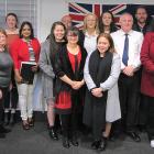 Central Otago Mayor Tim Cadogan (right) celebrates with new Central Otago citizens (from left)...