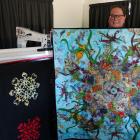 Weston-based quilter Mathea Daunheimer shows an example of a large quilt she has just completed...