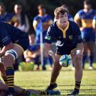 Dunedin's Tim Hogan passing the ball during the match between Dunedin and Taieri. Photo: Peter...