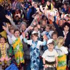 Sing it out ... Children from Carisbrook School and several pre-school centres raise their voices...