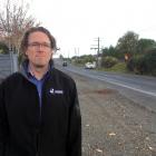 Dunedin City Council transportation safety team leader Hjarne Poulsen inspects a section of...
