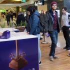 Cadbury employees Ben Epton and Yamta Zubiri hand out free chocolate to Eve Moodie and Book...