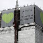 New hoarding covers the top of the Grenfell Tower to mark the first anniversary of the fire that...