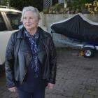 Glenda Alexander stands in the  space in her carport left after the burglary of one of her jet...