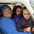 Dunedin woman Mel Coakes with children Sophie Lynch and Mason Lynch as they prepare to take off...